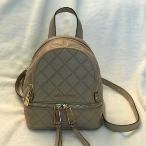 Michael Kors Quilted Rhea Mini Backpack in Bisque